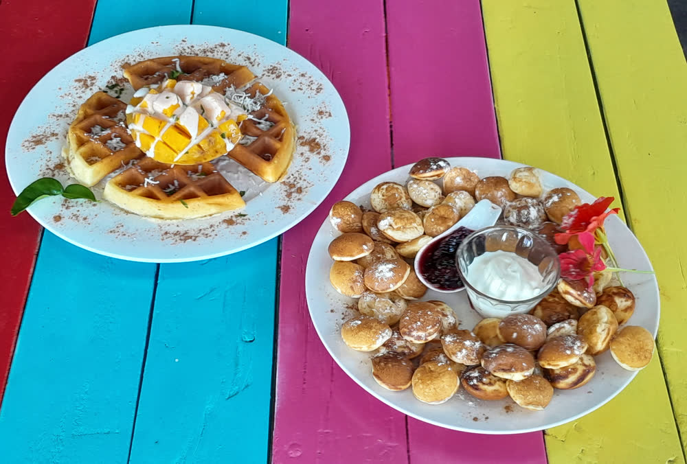 Waffles and warm pastries served on the deck